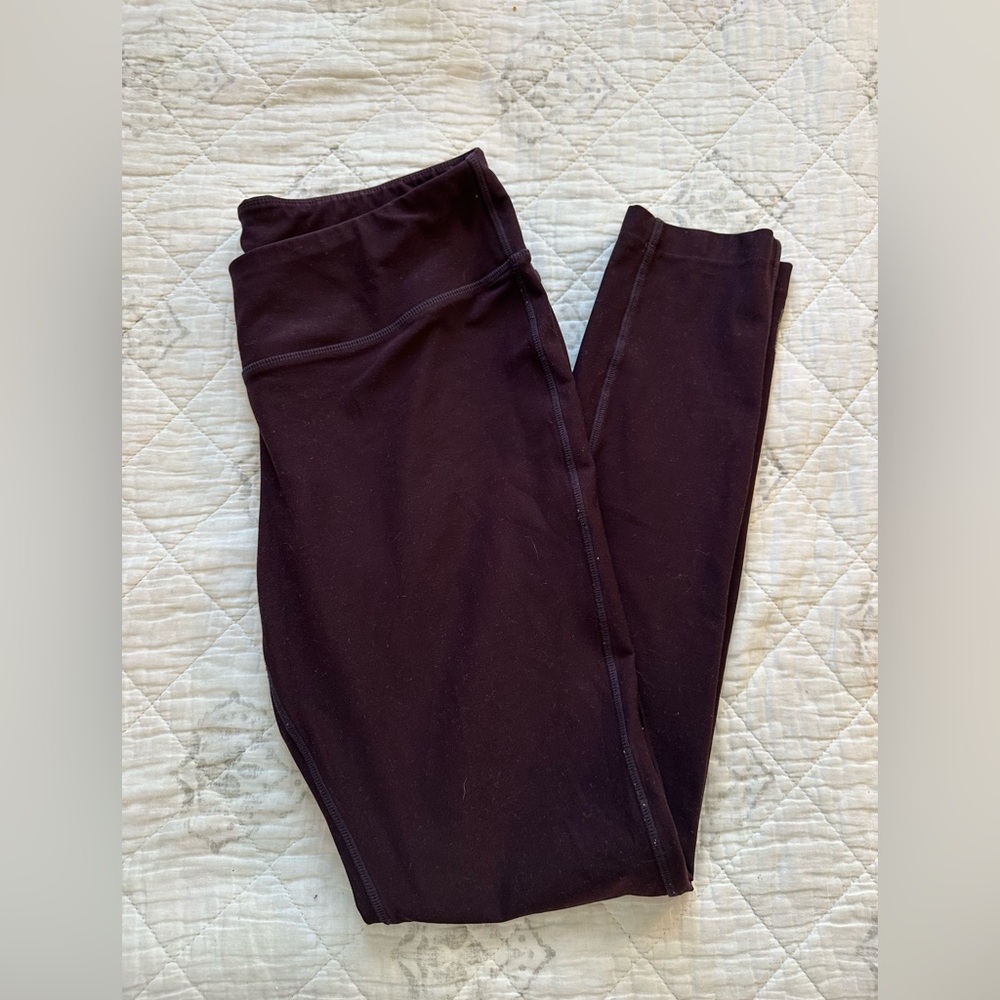 Woman’s burgundy plum leggings